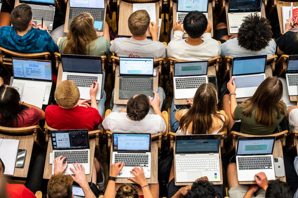 Students follow along with the lecture on their laptop computers in Chemistry 103 in Agricultural Hall at the University of Wisconsin-Madison during the first morning of classes for the Fall semester