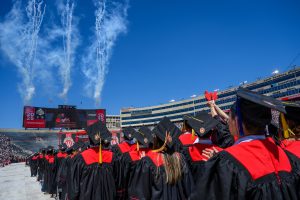 Graduates admire the fireworks display at the conclusion of UW–Madison's spring commencement ceremony at Camp Randall Stadium at the University of Wisconsin–Madison on May 10, 2025.